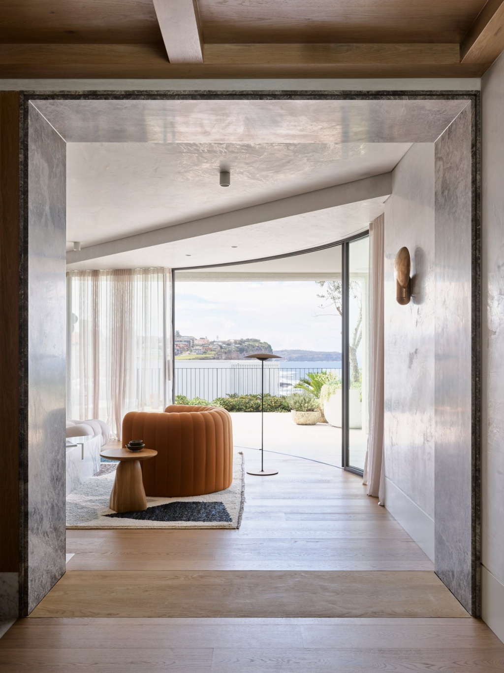 Pacific House Living Room Interior and Balcony View.