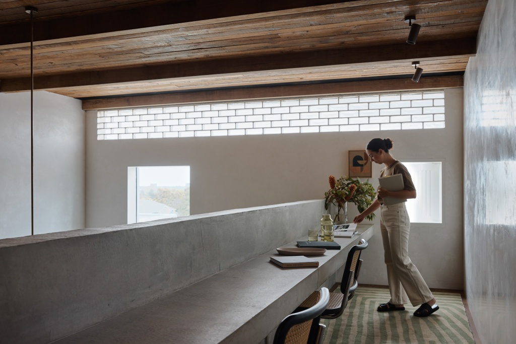 Mezzanine view with concrete desk bench.